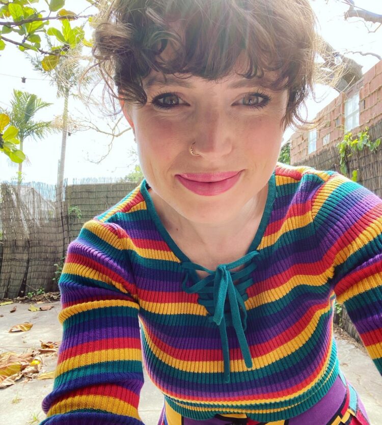 Jess Bracey Artist in Rainbow clothes